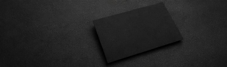 Business card on a dark surface